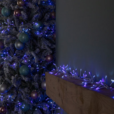 Samuel Alexander 12.4M 960 Led Christmas Cluster Multi-Action String Lights With Timer In Blue, Purple & White On Clear Cable - image 1