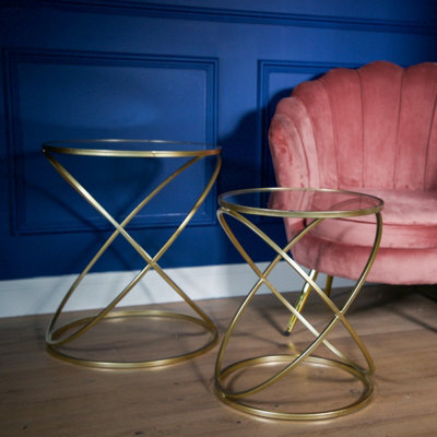 Madison & Mayfair Set Of 2 Gold Criss Cross Tables With Glass Top