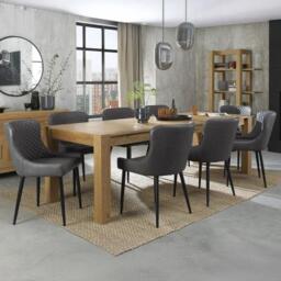 Bentley Designs Turin Light Oak 6-10 Seater Extending Dining Table with 8 Cezanne Dark Grey Faux Leather Chairs - Black Legs