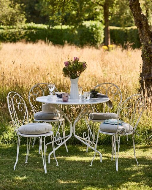 Dibor Four Person Indoor Outdoor Garden Iron Bistro Table & Chairs Set with Free Seat Pads in White - image 1