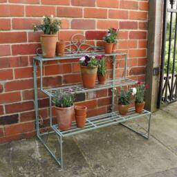 Melody Maison Sage Green Metal Three Tier Plant Theatre Stand in Dark Blue - thumbnail 1