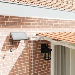 Berkfield Home Manual Retractable Awning with LED Yellow & Orange 400x300 cm - thumbnail 4