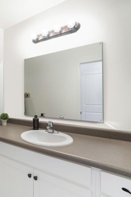 MirrorOutlet Circuitt 4mm Sheet Mirror Glass Polished Edges 4 Holes 100 x 70cm in Silver - Size: 1 Pack - image 1