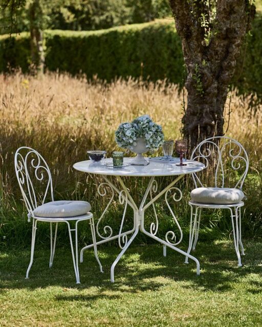 Dibor Traditional Two Person Garden Iron Bistro Table & Chairs Set with Free Seat Pads in White - image 1