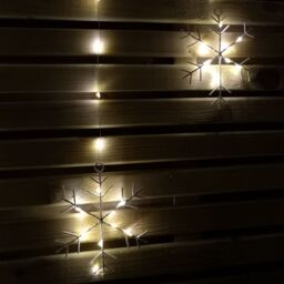 Samuel Alexander 1.2m Battery Operated Snowflake Christmas Curtain Lights with 147 Warm White LEDs in Beige - thumbnail 4