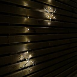 Samuel Alexander 1.2m Battery Operated Snowflake Christmas Curtain Lights with 147 Warm White LEDs in Beige - thumbnail 6