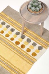 Homescapes Cotton Chenille Striped Tufted Circle Rug in Mustard - Size: 60 cm x 100 cm - thumbnail 1