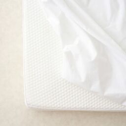 The Tiny Bed Company Waterproof Fitted Mattress Protector for Travel Cot - 95 x 65 cm in White - thumbnail 6