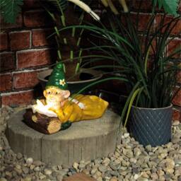 St Helens Female Gnome Lying by a Log in Green
