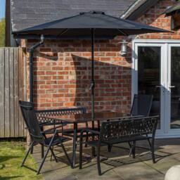 Samuel Alexander Outdoor 6 Person Glass Top Table Benches & Chairs, Havana Parasol & Base Set in Black - thumbnail 1