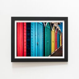 "Warren Reed - Designer Coloured Beach Huts Framed Art Print in Black - Size: W24"" x H36""" - thumbnail 1