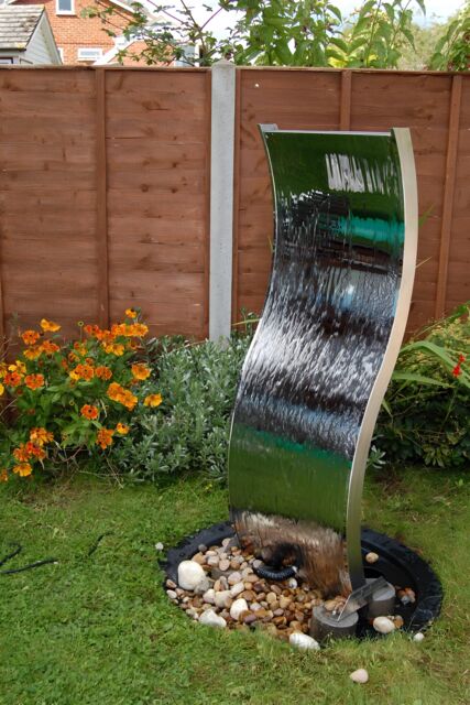 Primrose Stainless Steel Water Feature Wall Double Sided Curved 130cm Outdoor in Metallic Silver