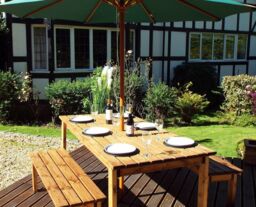 Charles Taylor Trading Six Seater Rectangular Table Set (with form benches) in Brown