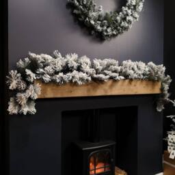 Samuel Alexander 6ft (1.8m) Premier Christmas Snow Flocked Green Garland with Pine Cones - thumbnail 1