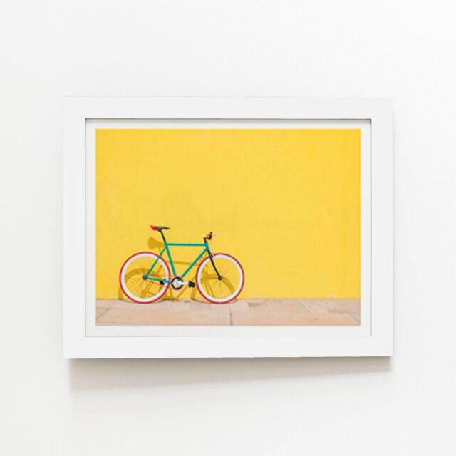 "Warren Reed - Designer Bike Against Yellow Framed Art Print in White - Size: W24"" x H36""" - image 1