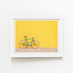 "Warren Reed - Designer Bike Against Yellow Framed Art Print in White - Size: W24"" x H36""" - thumbnail 2