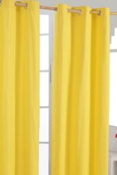Homescapes Plain Cotton Ready Made Eyelet Curtain Pair in Yellow - Size: 140 cm width x 229 cm drop - thumbnail 1