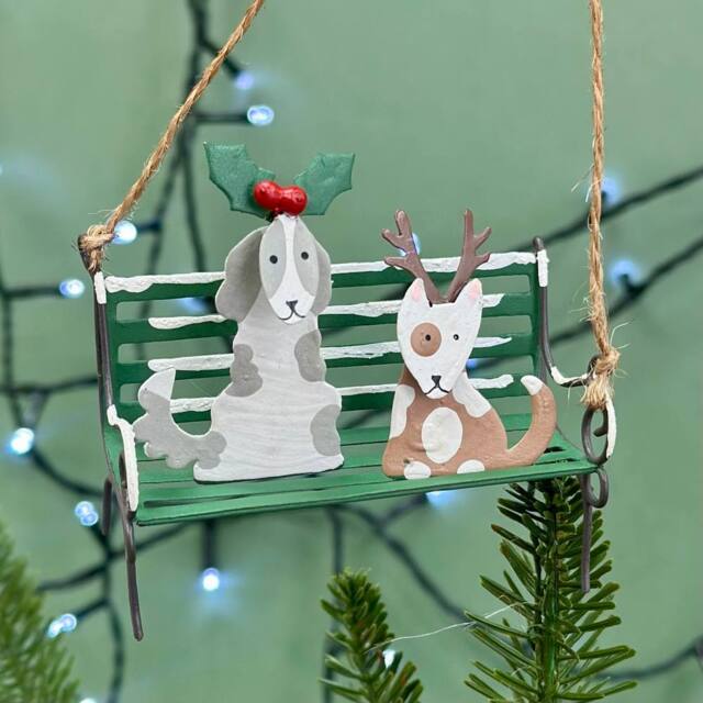 The Alphabet Gift Shop Christmas Dogs On A Park Bench Bauble in Green