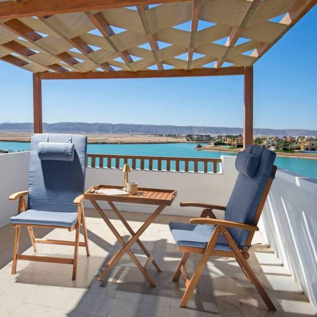 Wyld and Coco 2-Piece Folding Acacia Garden Chairs with Blue Cushions in Brown - image 1