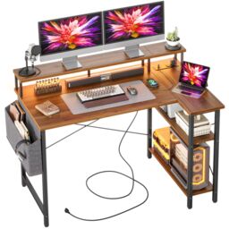 BEXEVUE L-Shaped Computer Gaming Desk with Power Outlets & Shelves 120×70cm in Walnut - Size: 120 cm x 70 cm