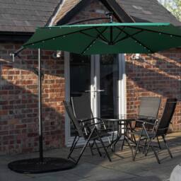 Samuel Alexander 4 Person Round Glass Top Table Chairs. Green Banana Lit Parasol & Base in Black - thumbnail 2