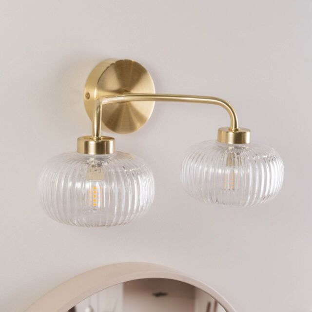 ValueLights Amaia Pair of Brushed Gold IP44 2 Way Clear Glass Wall Lights with LED Bulbs - image 1
