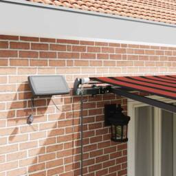 Berkfield Home Manual Retractable Awning with LED in Orange & Brown, 500x300 cm - thumbnail 4