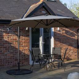 Samuel Alexander 4 Person Round Glass Top Table Chairs. Grey Banana Lit Parasol & Base in Black - thumbnail 2