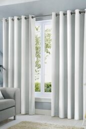 Fusion 'Sorbonne' 100% Cotton Light Filtering Plain Dyed Eyelet Curtains in White - Size: 117 cm width x 137 cm drop - thumbnail 1