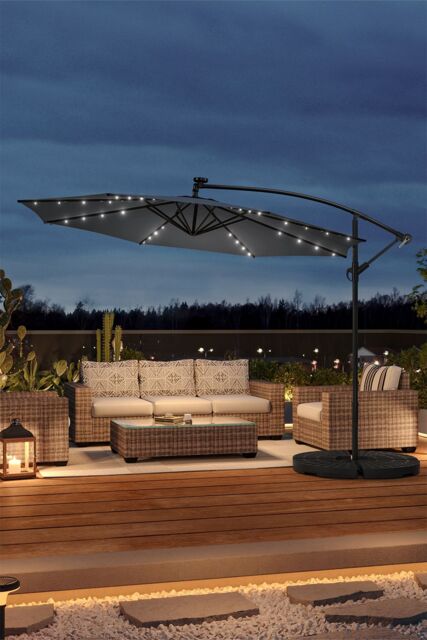grey lighted patio umbrella Lighthouse Casual Swirl Tilt Solar with LED Lights This umbrella is a versatile item that moves seamlessly from day to evening use Living and Home Outdoor 32