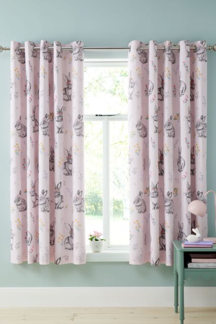 Catherine Lansfield 'Bunny Tails Ditsy Flowers' Fully Reversible Eyelet Curtains in Pink - Size: 168 cm width x 183 cm drop - image 1