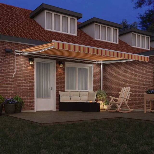 Berkfield Home Manual Retractable Awning with LED in Yellow & Orange, 450x300 cm - image 1