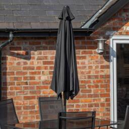 Samuel Alexander Outdoor 6 Person Glass Top Dining Table Chairs. Black Parasol & Base - thumbnail 4