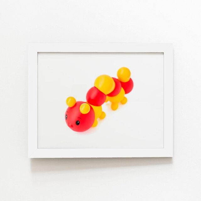 "Warren Reed - Designer Rubber Toy Catepillar Framed Art Print in White - Size: W20"" x H30""" - image 1