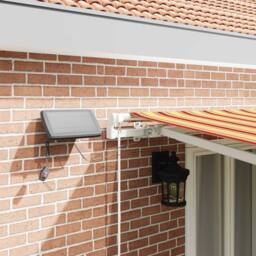 Berkfield Home Manual Retractable Awning with LED Yellow & Orange 500x300 cm - thumbnail 4