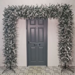 Samuel Alexander 8ft Indoor Flocked PVC Christmas Tree Arch with Snow Tips & Flat Top in Green - thumbnail 1