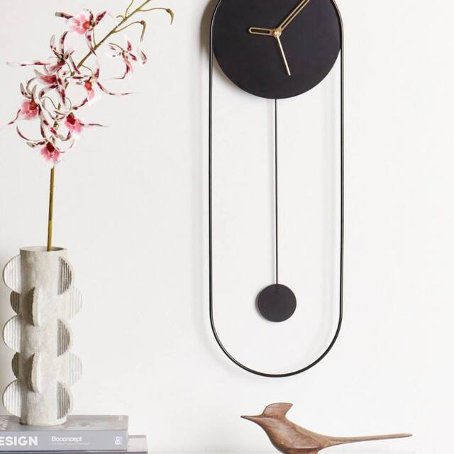 Wyld and Coco Oval Wall Clock Black Painted Steel Pendulum 20 x 62 cm - image 1