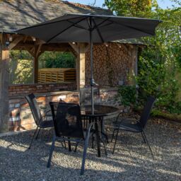 Samuel Alexander Outdoor 4 Person Round Glass Top Garden Dining Table & Chairs Set with Havana Parasol in Grey - thumbnail 2