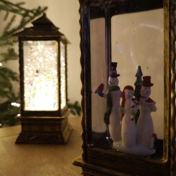 Samuel Alexander 27cm Dual Powered Light up Christmas Water Spinner Lantern with Snowman Scene in Bronze