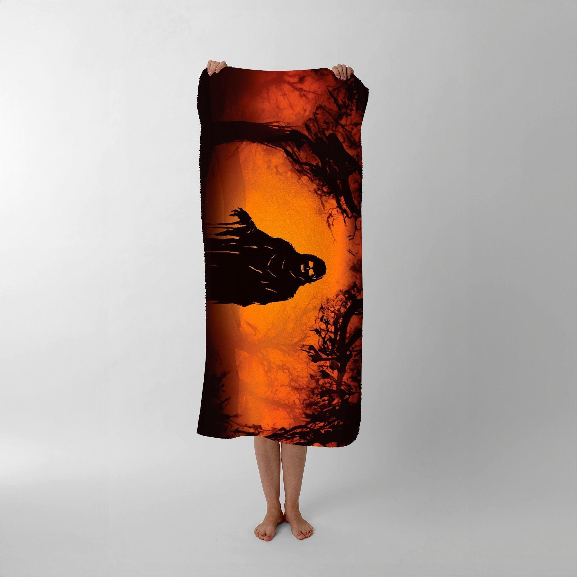 A Spooky Black And Orange Ghost Beach Towel - image 1