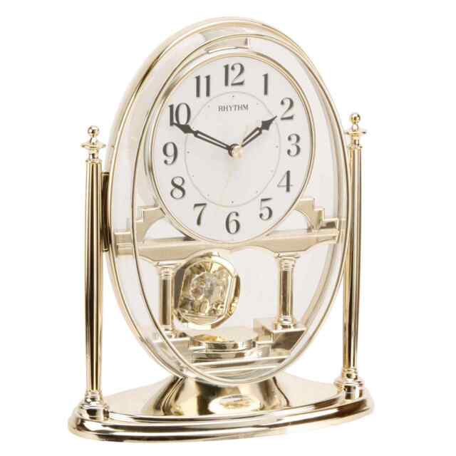 Rhythm Gold Oval Mantel Clock With Swinging Pendulum Crp609wr18