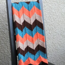 Hand-Knitted Chevron Baby Blanket Teal, Beige, Brown, & Orange - thumbnail 3