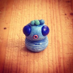 Mini Blue Monster Sculpture & Its Crest