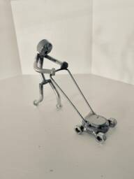 Welded Metal Art Lawnmower Man Sculpture - thumbnail 1