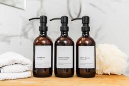 Amber Plastic Refillable Dispenser Bottles Minimalist Shampoo, Conditioner, Soap With Metal Pump