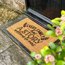 Every Family Has A Story , Welcome To Ours Doormat - Heartfelt Entry Rug, Cozy Home Decor, Quote Mat Housewarming Gift Idea - thumbnail 1