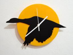 Goose Flying - Black & Yellow Silhouette Wall Clock
