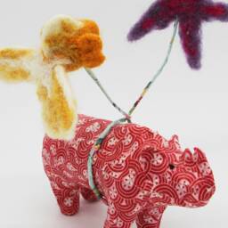 Red Paper Mache Rhinoceros With Needle Felt Balloons - thumbnail 2