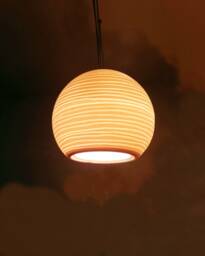 Handmade Porcelain Pendant Light Carved Sphere, Amber Glow