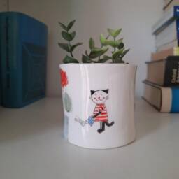 Handmade Ceramic Plant Pot With Cat Watering Flowers - thumbnail 2